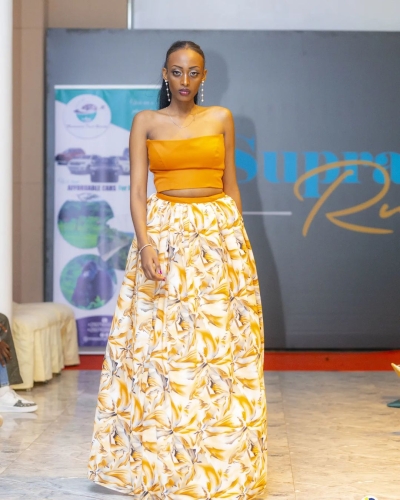 [PHOTO: Supra Model on the runway during a fashion show in Kigali, Collection made by  Urugero Fashions Ltd]