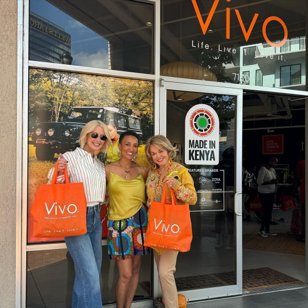 PHOTO: Wandia Gichuru Co-Founder and CEO of Vivo Woman standing in the middle of two clients after shopping from Vivo fashion USA store in Atlanta, the USA